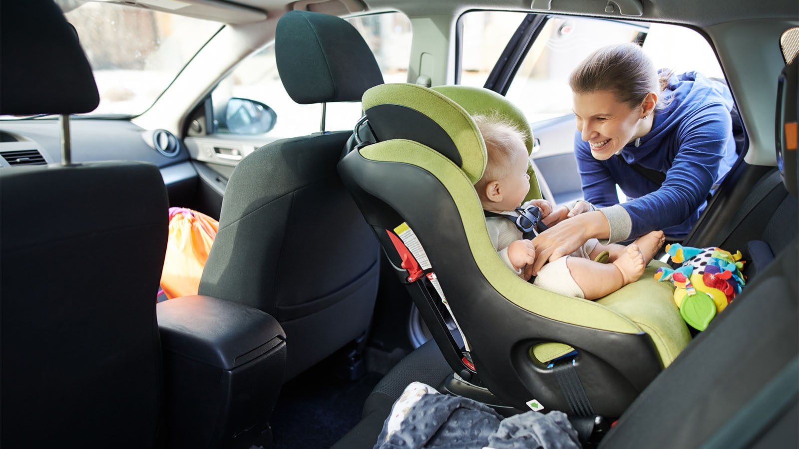 Child safely secured in a car seat
